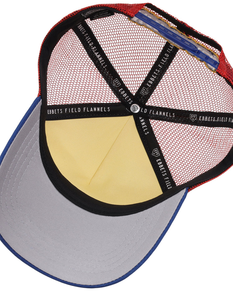 Inside view of the Northwest Arkansas Naturals MiLB Trucker Ballcap by Ebbets Field, featuring a red mesh back, blue brim, yellow front panel, and black inner bands labeled 