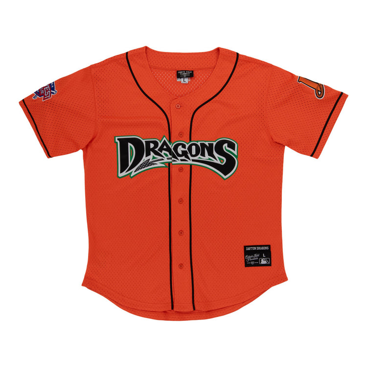 The Ebbets Field Dayton Dragons MiLB Button Down Jersey features a bright orange body with black trim, 