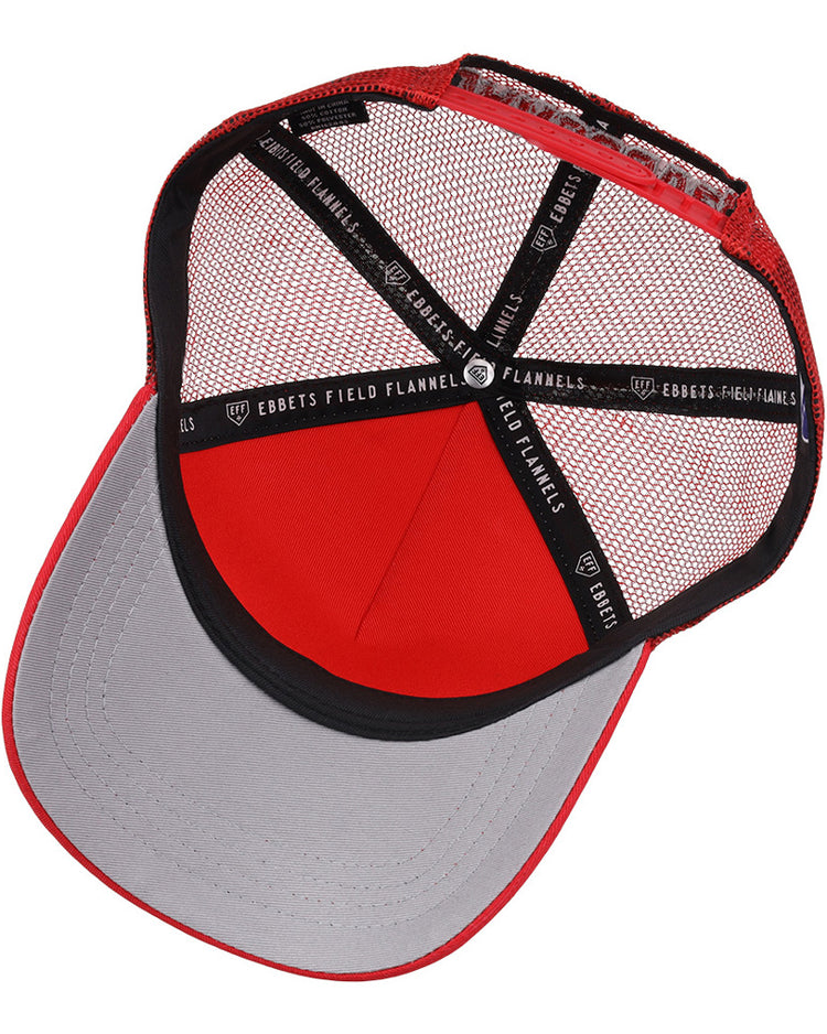 A top-down view of the inside of a red and gray Vancouver Canadians MiLB Trucker Ballcap by Ebbets Field, featuring black interior linings with repeated white “EBBETS FIELD FLANNELS” text.