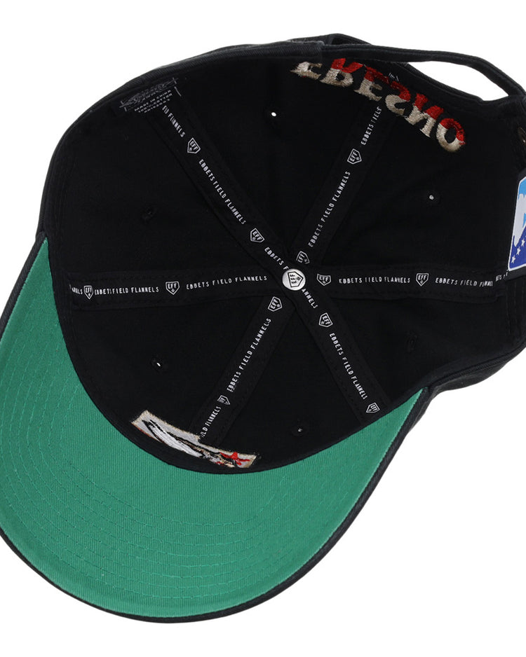 The underside of the Fresno Grizzlies MiLB Dad Ballcap by Ebbets Field features a green brim, visible inner stitching, branded black fabric tape with white logos and text, tags, labels, and a small patch sewn near the back.