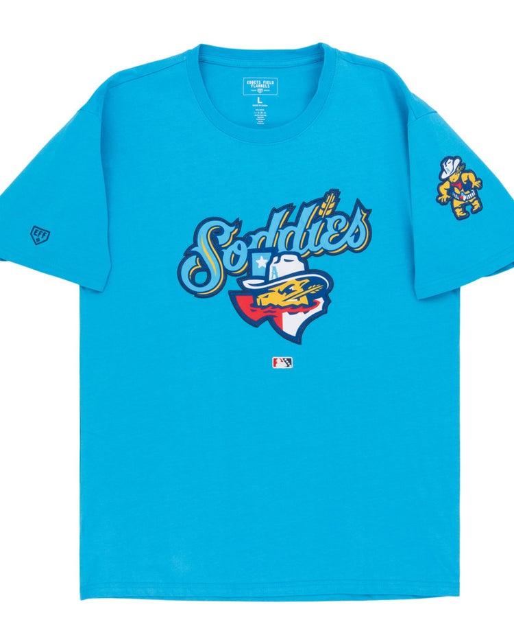 The Ebbets Field Amarillo Sod Poodles MiLB Fashion Cotton Short Sleeve Tee features a bright blue design with a colorful prairie dog “Sod Poodles” logo up front and a smaller graphic on the left sleeve.