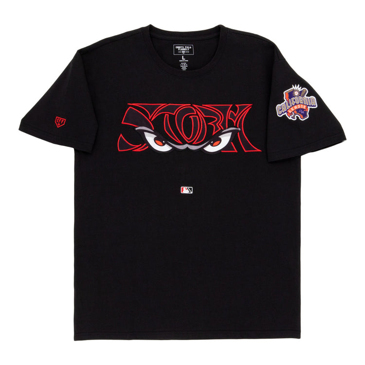 The Ebbets Field Lake Elsinore Storm MiLB Fashion Cotton Short Sleeve Tee is a black shirt with bold red-outlined cartoon eyes on the chest, an MLB logo underneath, and a colorful 
