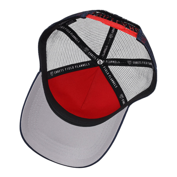 Inside the Portland Sea Dogs MiLB Trucker Ballcap by Ebbets Field, black mesh panels, a red fabric section, a gray brim, and black strips labeled Ebbets Field are visible.