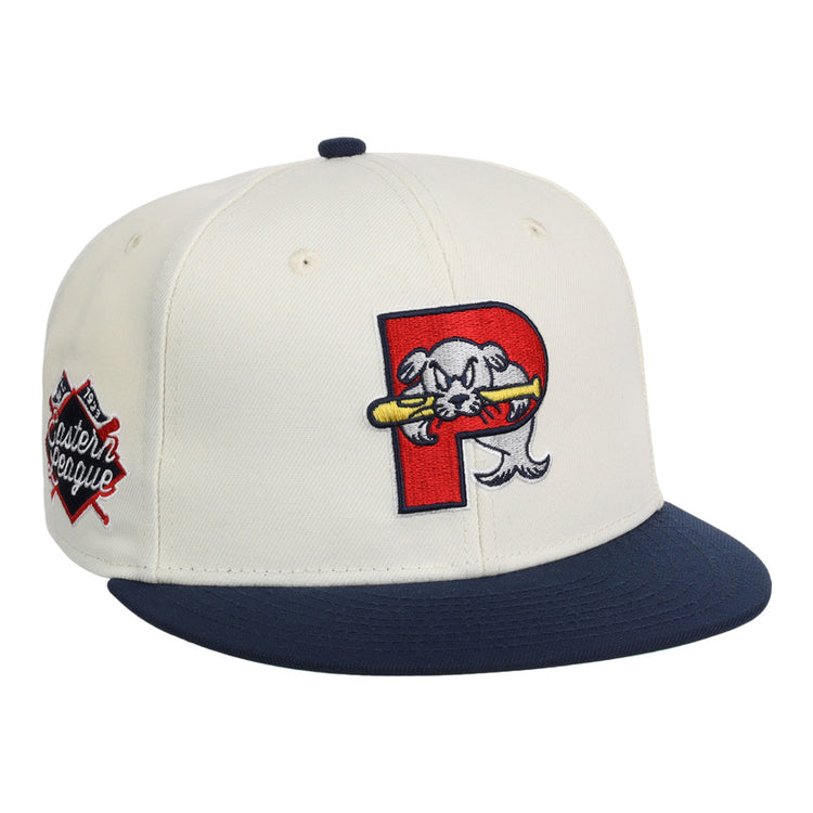 The Ebbets Field Portland Sea Dogs MiLB Snapback Ballcap is white with a navy blue brim, a red 