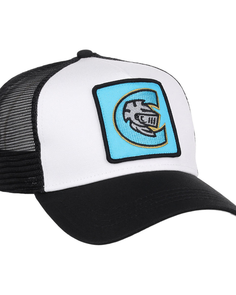The Ebbets Field Charlotte Knights MiLB Trucker Ballcap is black and white with a curved bill, mesh back, and features a blue patch on the front showing a stylized fish logo inside the letter C.