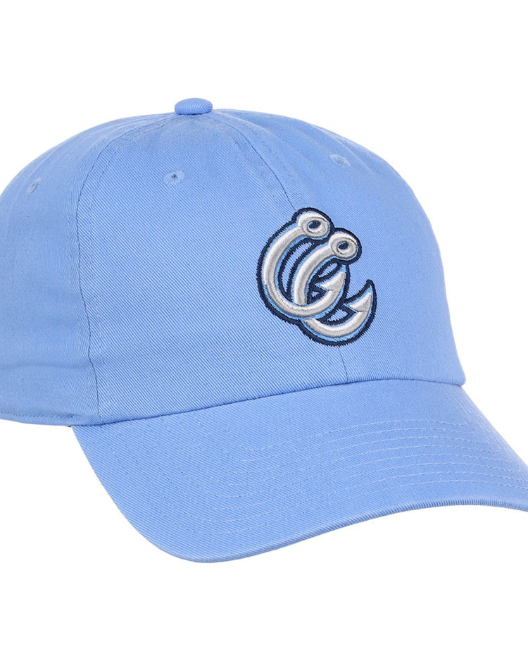 The Ebbets Field Corpus Christi Hooks MiLB Dad Ballcap is a light blue hat featuring an embroidered cartoonish letter C with eyes and a curled design on the front.