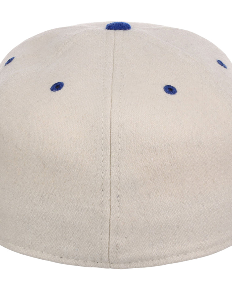 The Ebbets Field St. Louis Stars NLB Ballpark Fitted Ballcap is beige, shown from the back with blue stitched eyelets and a matching blue top button.