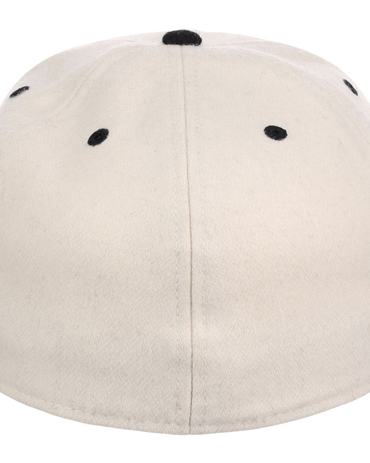 The New York Black Yankees NLB Ballpark Fitted Ballcap by Ebbets Field is beige, shown from the back, and features six black embroidered eyelets plus a black button on top.