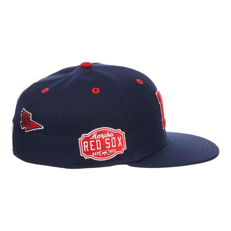 The Memphis Red Sox NLB Varsity Fitted Ballcap by Ebbets Field is a navy blue flat-brim hat with red and white embroidered patches, including 