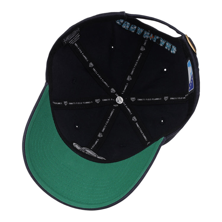 A look inside the Ebbets Field Sugarland Space Cowboys MiLB Dad Ballcap shows a green underbrim, black interior, and inner seams with white text and graphics.