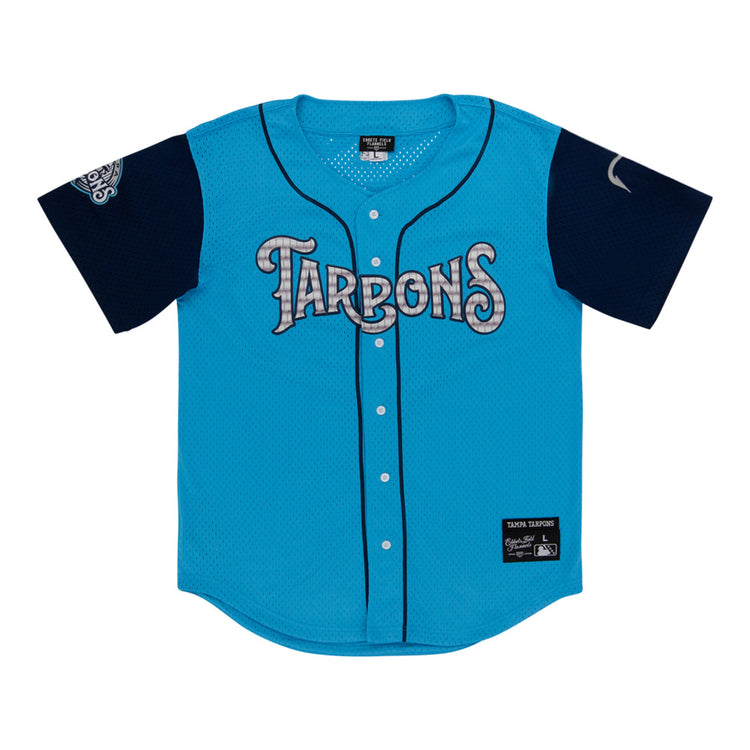 The Ebbets Field Tampa Tarpoons MiLB Button Down Jersey is light blue with 