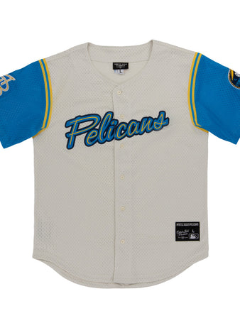 The Myrtle Beach Pelicans MiLB Button Down Jersey by Ebbets Field is a white mesh baseball jersey with “Pelicans” in blue script, blue sleeves with yellow trim, a bird logo on the right, and a GP monogram on the left.