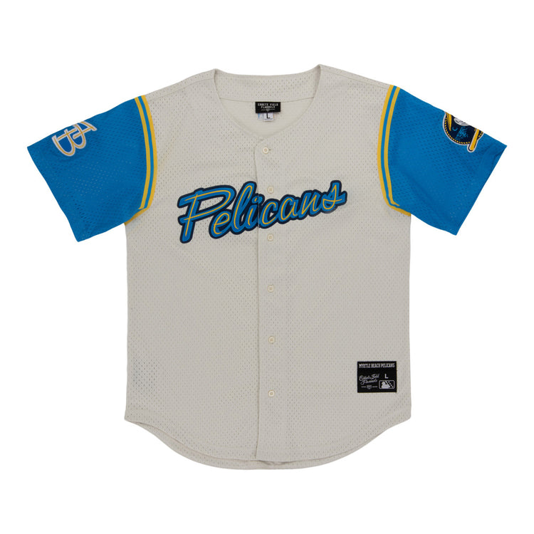 The Myrtle Beach Pelicans MiLB Button Down Jersey by Ebbets Field is a white mesh baseball jersey with “Pelicans” in blue script, blue sleeves with yellow trim, a bird logo on the right, and a GP monogram on the left.