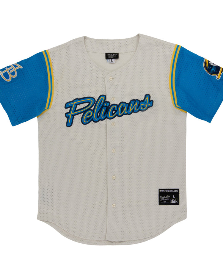 The Myrtle Beach Pelicans MiLB Button Down Jersey by Ebbets Field is a white mesh baseball jersey with “Pelicans” in blue script, blue sleeves with yellow trim, a bird logo on the right, and a GP monogram on the left.