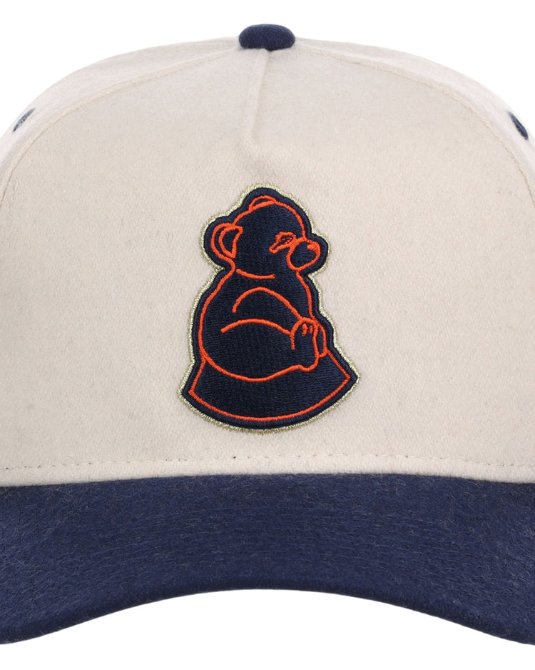 The Ebbets Field San Francisco Sea Lions NLB Ballpark A-Frame Ballcap is beige with a navy brim and showcases an embroidered orange and navy bear outline on the front.