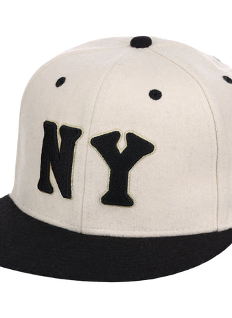 The Ebbets Field New York Black Yankees NLB Ballpark Fitted Ballcap is a white cap with a black brim, bold NY lettering on the front, and black stitched eyelets.