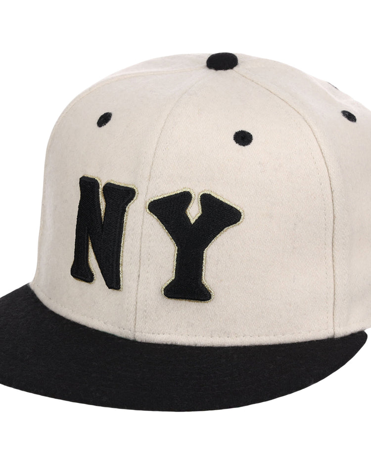The Ebbets Field New York Black Yankees NLB Ballpark Fitted Ballcap is a white cap with a black brim, bold NY lettering on the front, and black stitched eyelets.
