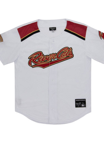 The Ebbets Field Sacramento River Cats MiLB Button Down Jersey is white with red and black accents, features the team logo across the chest, a left sleeve patch, black collar tag, and an official patch near the bottom hem.