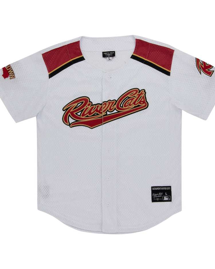 The Ebbets Field Sacramento River Cats MiLB Button Down Jersey is white with red and black accents, features the team logo across the chest, a left sleeve patch, black collar tag, and an official patch near the bottom hem.