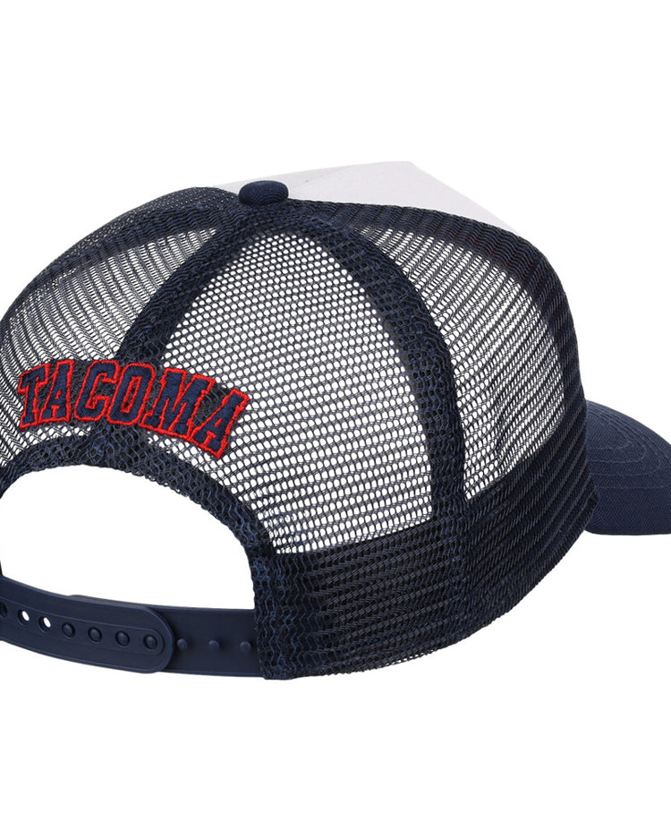 The Seattle Rainers MiLB Trucker Ballcap by Ebbets Field is a navy blue and white mesh-back hat with an adjustable strap. 
