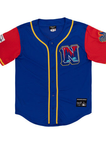 The Ebbets Field Northwest Arkansas Naturals MiLB Button Down Jersey features blue fabric, yellow trim, red sleeves, a left-sleeve patch, lion logo on the right sleeve, and a chest 