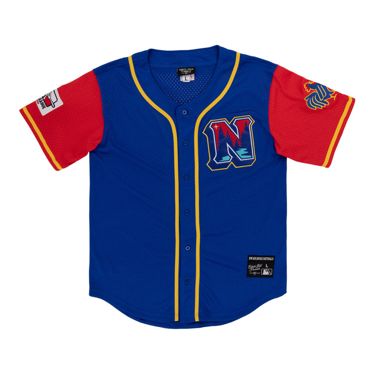 The Ebbets Field Northwest Arkansas Naturals MiLB Button Down Jersey features blue fabric, yellow trim, red sleeves, a left-sleeve patch, lion logo on the right sleeve, and a chest 