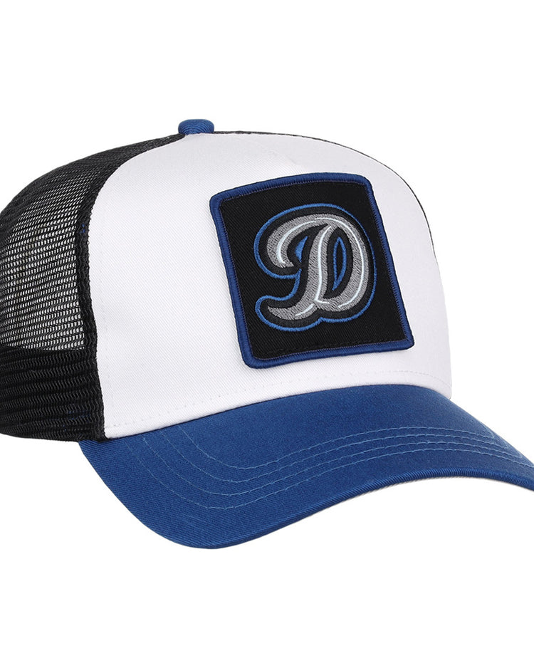 The Ebbets Field Tulsa Drillers MiLB Trucker Ballcap features a white front panel, blue bill, black mesh back, and a black patch with a large embroidered letter D on the front.