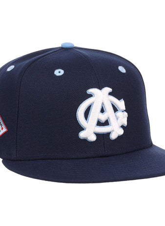 The Ebbets Field Chicago American Giants NLB Varsity Fitted Ballcap features a navy blue design with a white and light blue 