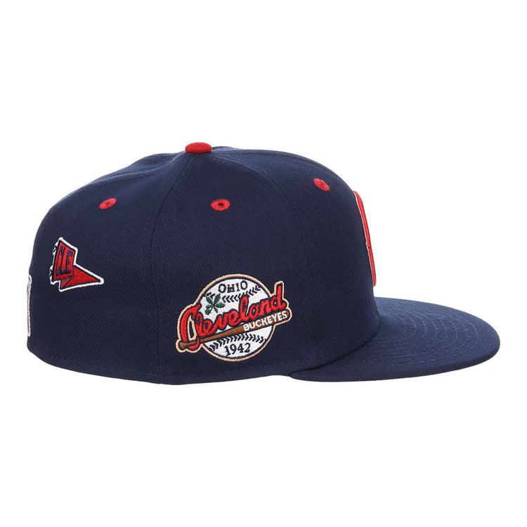 The Ebbets Field Cleveland Buckeyes NLB Varsity Fitted Ballcap is a navy blue cap with red and white patches, including a triangular pennant and round 