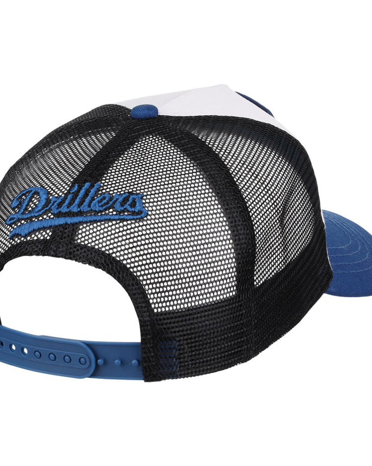 The Ebbets Field Tulsa Drillers MiLB Trucker Ballcap features a blue brim, white front panel, black mesh back with “Drillers” in blue script embroidery, and an adjustable blue snapback closure.