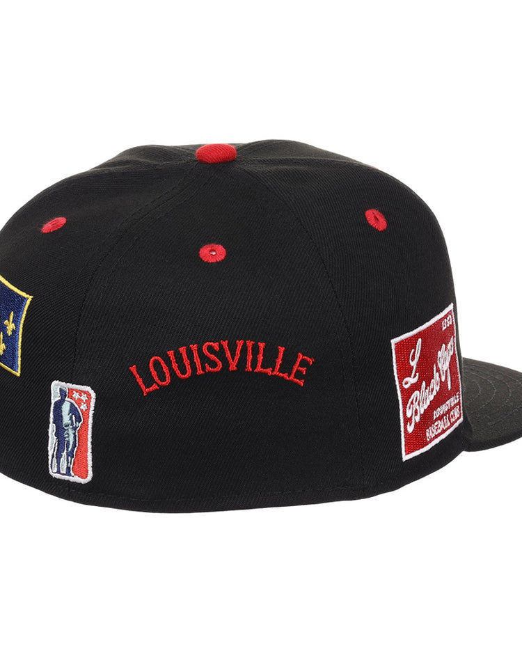 The Louisville Black Caps NLB Varsity Fitted Ballcap by Ebbets Field is a black cap with red accents and embroidered patches including 