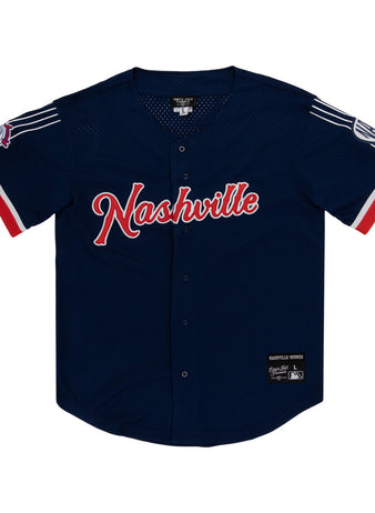 The Ebbets Field Nashville Sounds MiLB Button Down Jersey features navy blue fabric with red and white accents, 