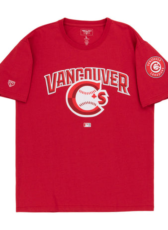 The Vancouver Canadians MiLB Fashion Cotton Short Sleeve Tee by Ebbets Field features a red design with a Vancouver logo and baseball graphic on the chest, plus a circular Vancouver Canadians patch on the left sleeve.