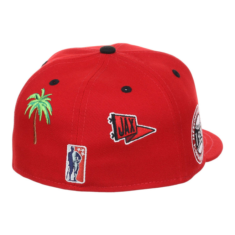 The Ebbets Field Jacksonville Red Caps NLB Varsity Fitted Ballcap is a red hat featuring embroidered patches: a green palm tree, a red 