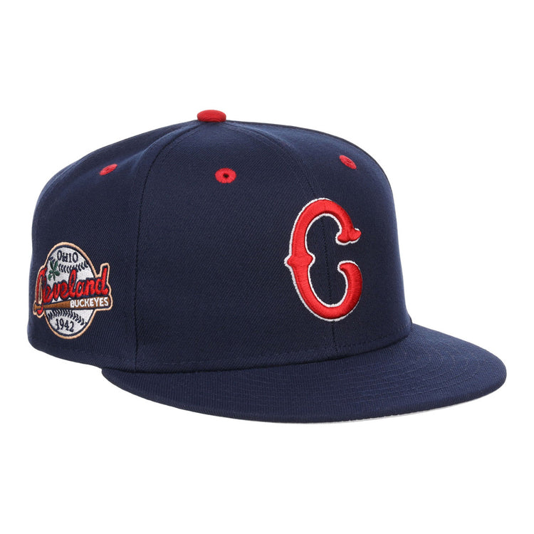The Cleveland Buckeyes NLB Varsity Fitted Ballcap by Ebbets Field features a navy blue design with a red and white C logo, side patch reading 