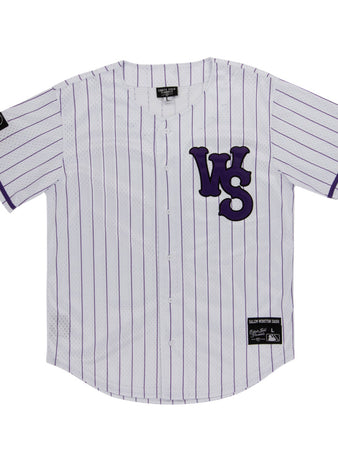 The Ebbets Field Winston-Salem Dash MiLB Button Down Jersey is a white jersey with thin purple stripes, bold purple WS letters on the left chest, and black label patches on the right sleeve and lower left front.