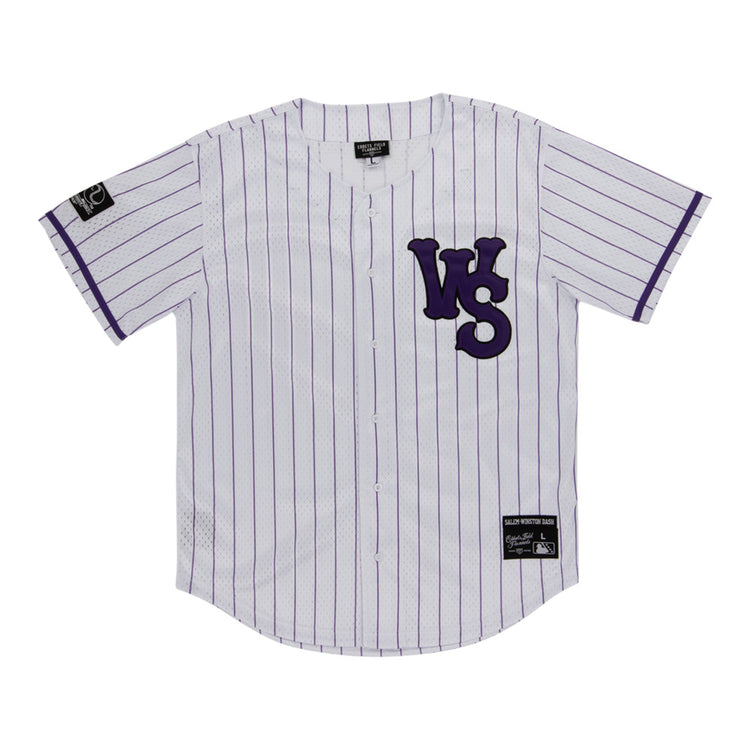 The Ebbets Field Winston-Salem Dash MiLB Button Down Jersey is a white jersey with thin purple stripes, bold purple WS letters on the left chest, and black label patches on the right sleeve and lower left front.