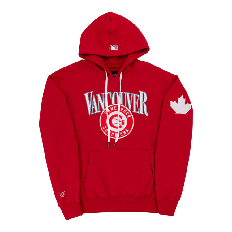 The Ebbets Field Vancouver Canadians MiLB Cotton Hooded Sweatshirt features red fabric, “Vancouver” and “Canadians” on the chest, a maple leaf on the left sleeve, white drawstrings, and a front pocket.
