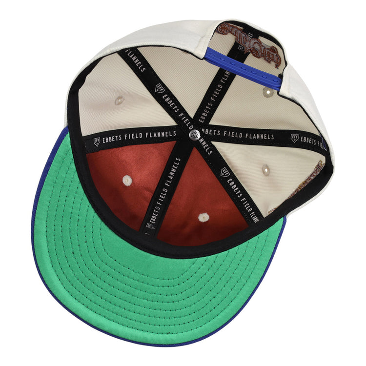 The underside of the Ebbets Field Durham Bulls MiLB Two Tone Snapback Ballcap features a green brim, brown crown panels, black EBBETS FIELD FLANNELS taped seams, and a blue adjustable strap at the back.