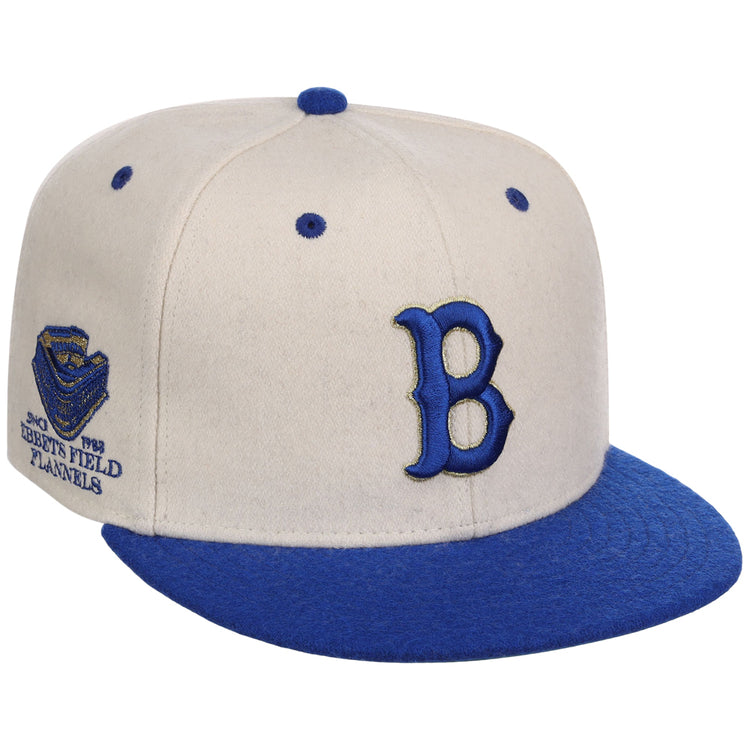 The Brooklyn Royal Giants NLB Ballpark Fitted Ballcap by Ebbets Field features beige and blue colors, a large blue 