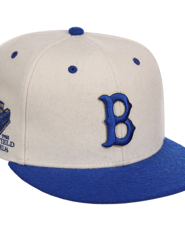 The Brooklyn Royal Giants NLB Ballpark Fitted Ballcap by Ebbets Field features beige and blue colors, a large blue 