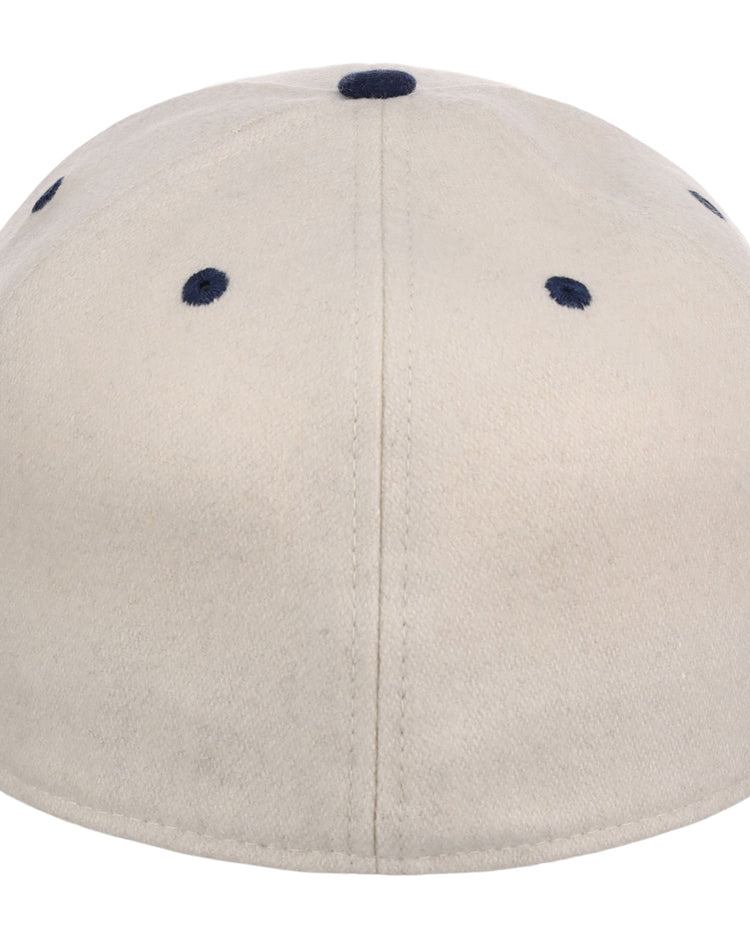 The Ebbets Field San Francisco Sea Lions NLB Ballpark Fitted Ballcap is beige, seen from the back with dark blue stitched eyelets and a central seam.