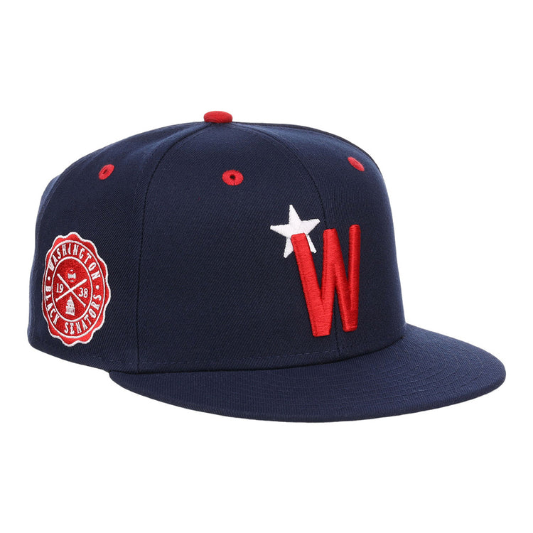 The Ebbets Field Washington Black Senators NLB Varsity Fitted Ballcap features a navy design, red and white W logo with star on the front, a side Nationals patch, flat brim, and red eyelets.