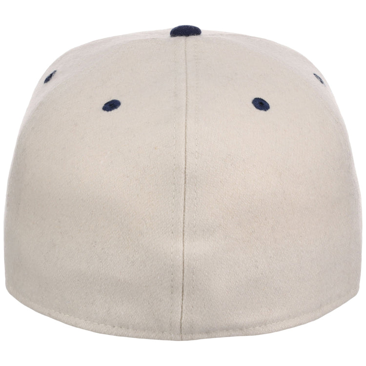 The Ebbets Field Atlanta Black Crackers NLB Ballpark Fitted Ballcap is beige, shown from the back with a central seam and four navy blue ventilation holes near the top.