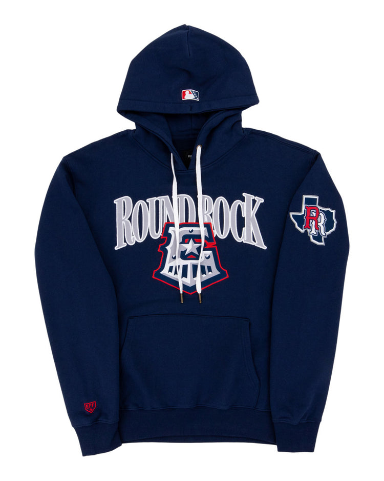 The Ebbets Field Round Rock Express MiLB Cotton Hooded Sweatshirt features navy blue fabric, ROUND ROCK in large white letters on the chest, an emblem below, a left sleeve patch with an R and Texas outline, a front pocket, and white drawstrings.