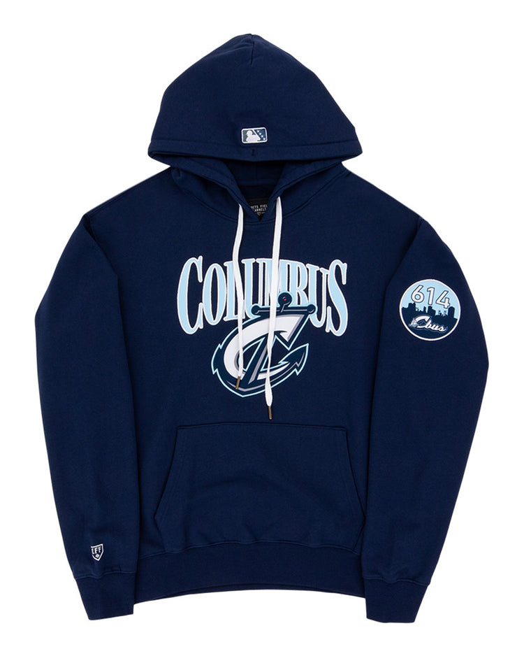 The Ebbets Field Columbus Clippers MiLB Cotton Hooded Sweatshirt is a navy blue hoodie with white drawstrings, COLUMBUS and a stylized C logo on the front, a circular 614 Class patch on the left sleeve, and a small logo near the left wrist.