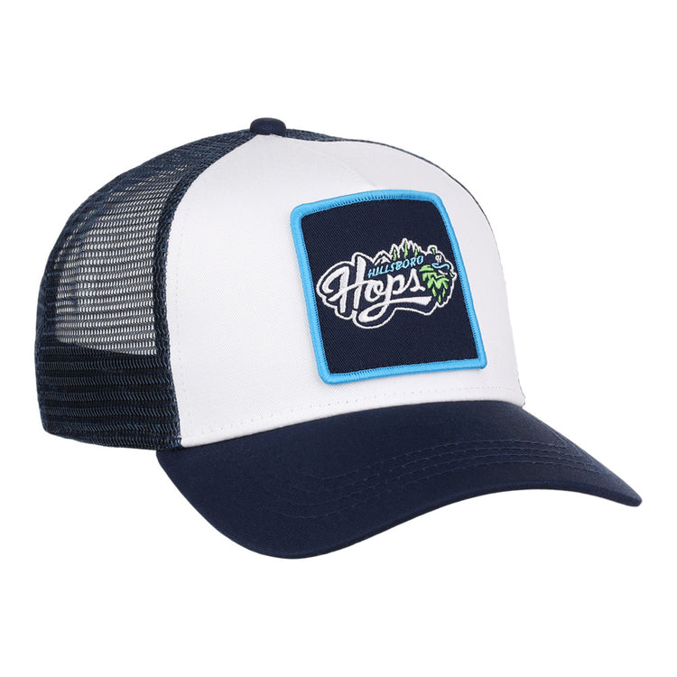 The Ebbets Field Hillsboro Hops MiLB Trucker Ballcap features a navy blue and white mesh back, plus a front patch with 