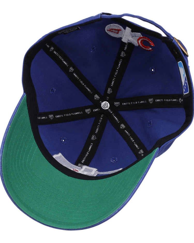 Inside view of the Ebbets Field Oklahoma City Dodgers MiLB Dad Ballcap: blue exterior, green underbrim, black lining bands, white seam tags, small ventilation holes, and branded stitching.