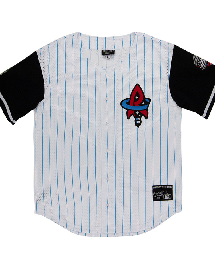 The Ebbets Field Rocket City Trash Pandas MiLB Button Down Jersey is white with thin blue stripes, black sleeves, a red and black rocket logo on the chest, and patches on the lower front and left sleeve.