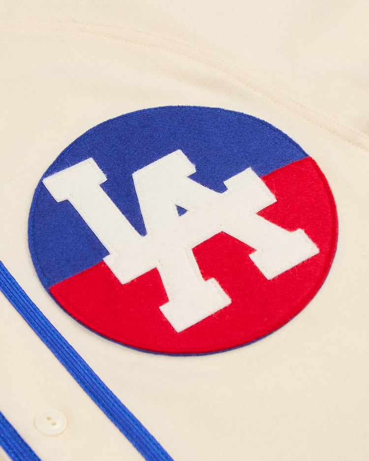 Ebbets Field Los Angeles Angels (PCL) 1946 Authentic Wool Home Jersey in off-white, featuring a circular patch with a white LA logo over a blue and red split background.